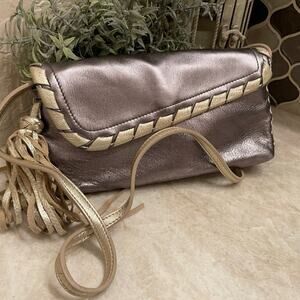 Camila Alves metallic shoulder bag wristlet convertible with fringed tassel